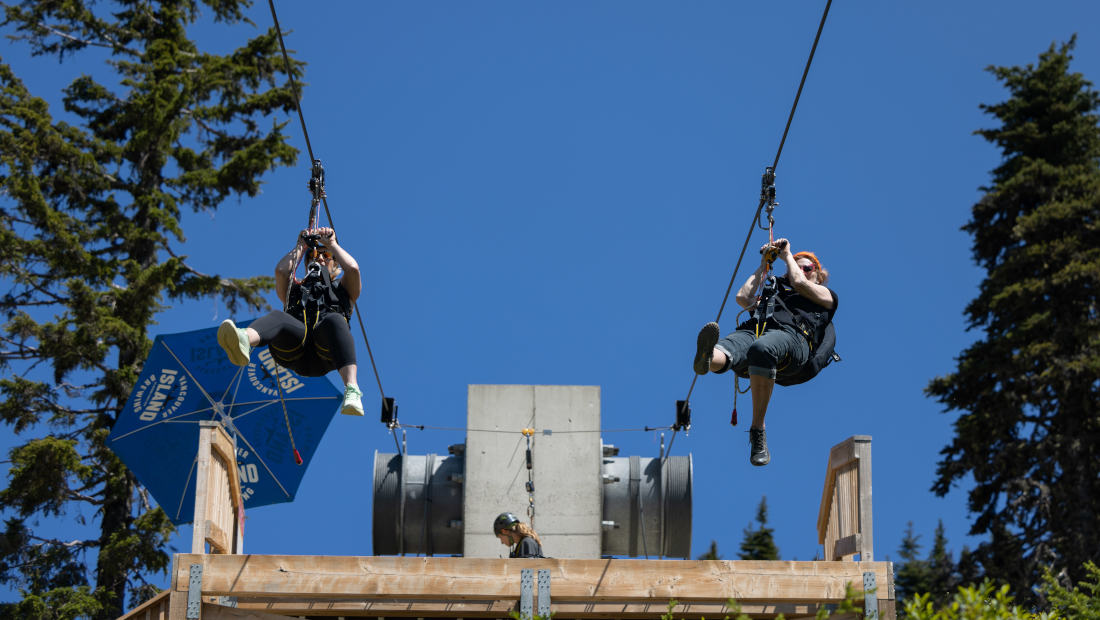 Riders blasting off on the Holy Hawk zipline