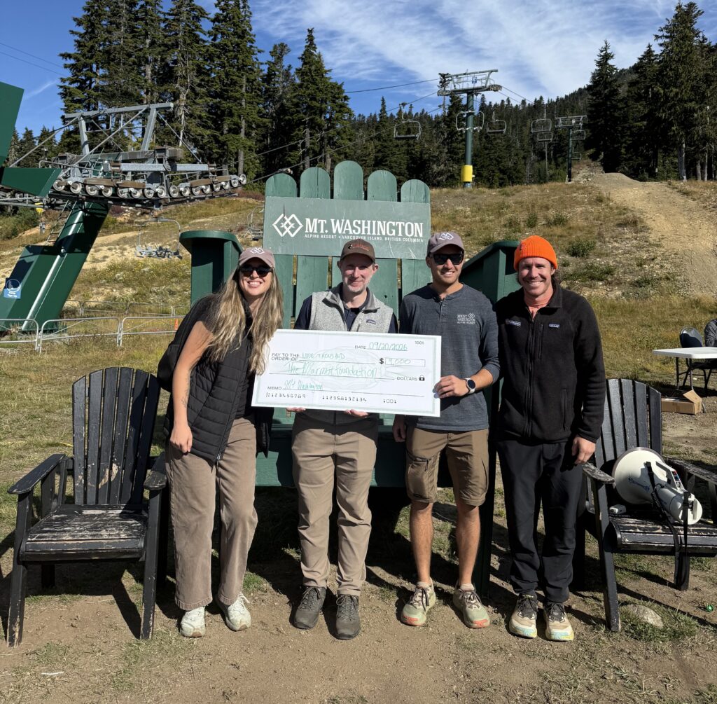 The Mount Washington and Frontrunners team presenting a large cheque to the Marmot Recovery Foundation.