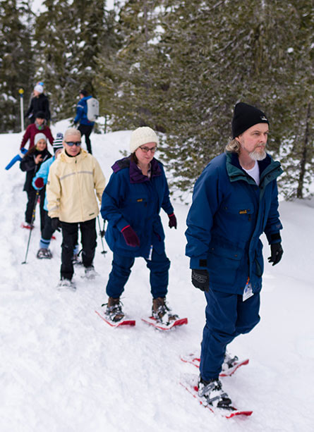 Snowshoers heading into the trees at Mount Washington